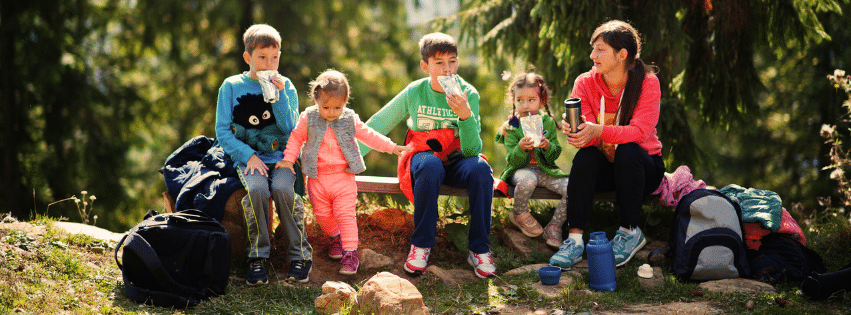 Family enjoying a hike picnic after school in Colorado.